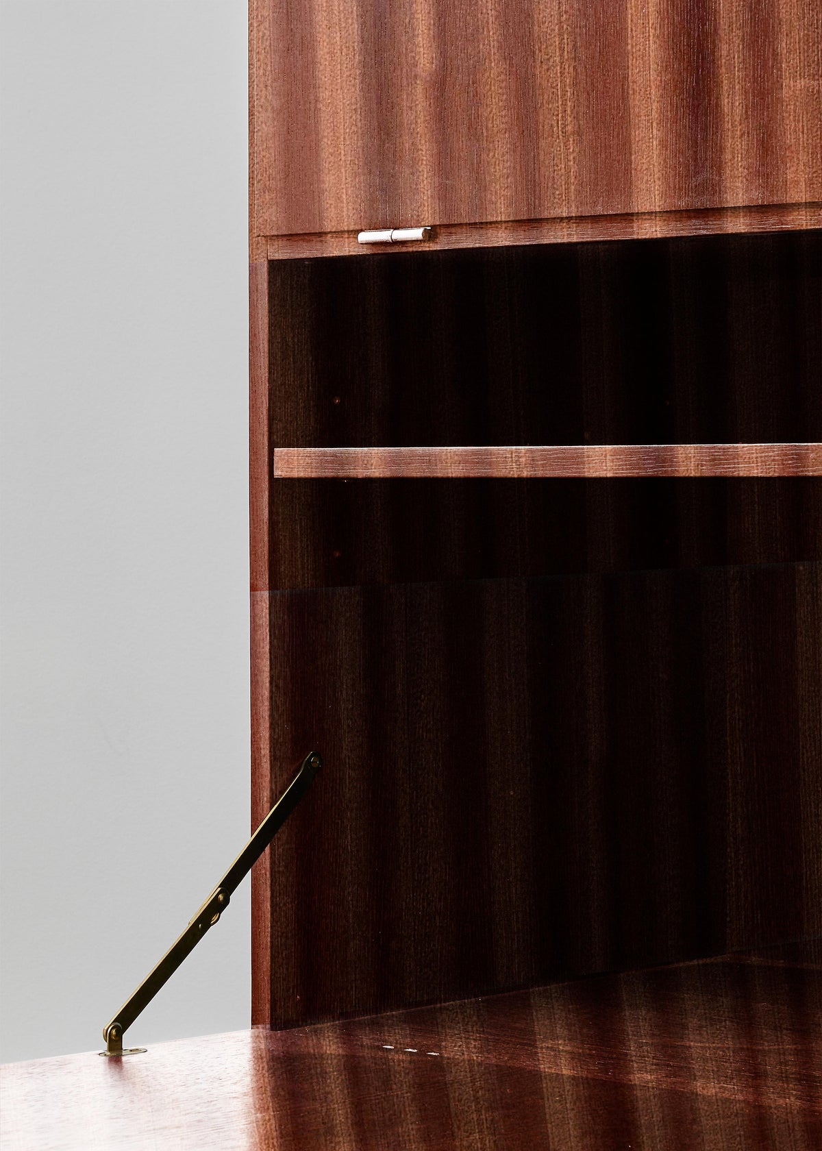 PH Cabinet by Poul Henningsen, Danish design classic (1930s)
A mahogany wooden storage cabinet with three concealed compartments and gold-colored accents.
