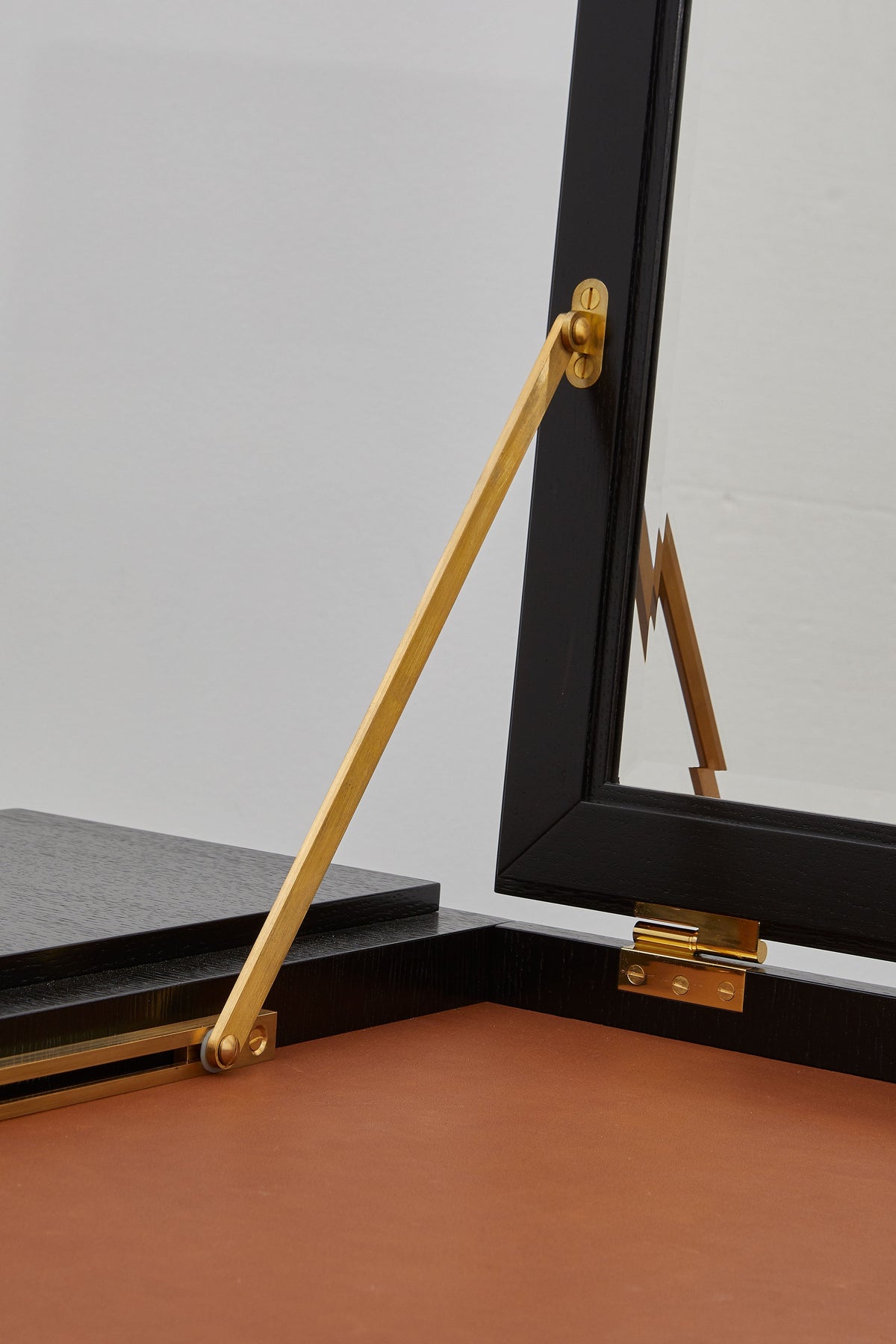 PH Grand Dressing Table by Poul Henningsen, Danish design classic (1919)
Black PH Grand Dressing Table with five drawers and gold-colored accents on the frame and handles, featuring a fold-down mirror.