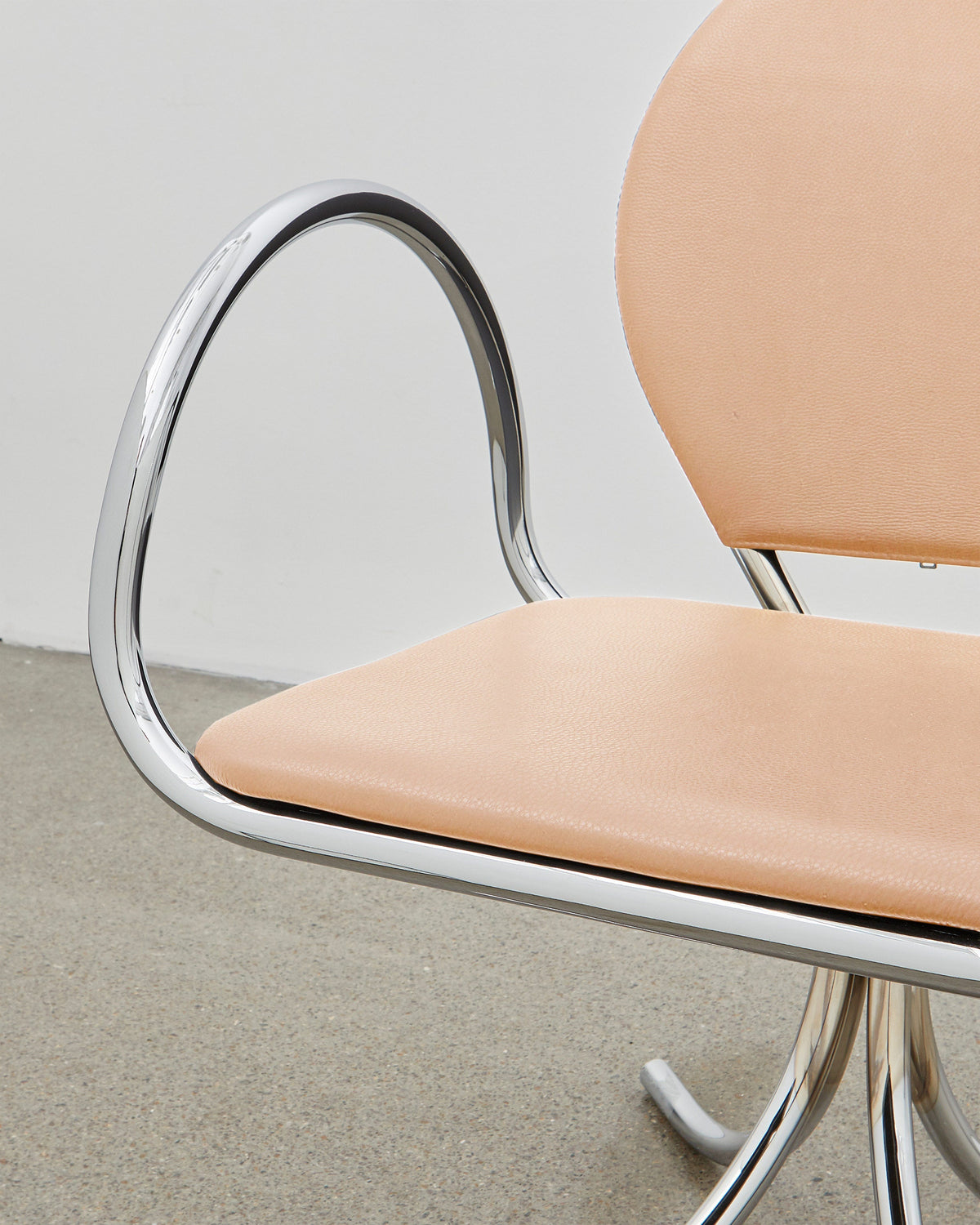 PH Arm Chair by Poul Henningsen, Danish design classic (1932),A armchair with a beige cushioned seat and backrest, and chrome steel tube frame.