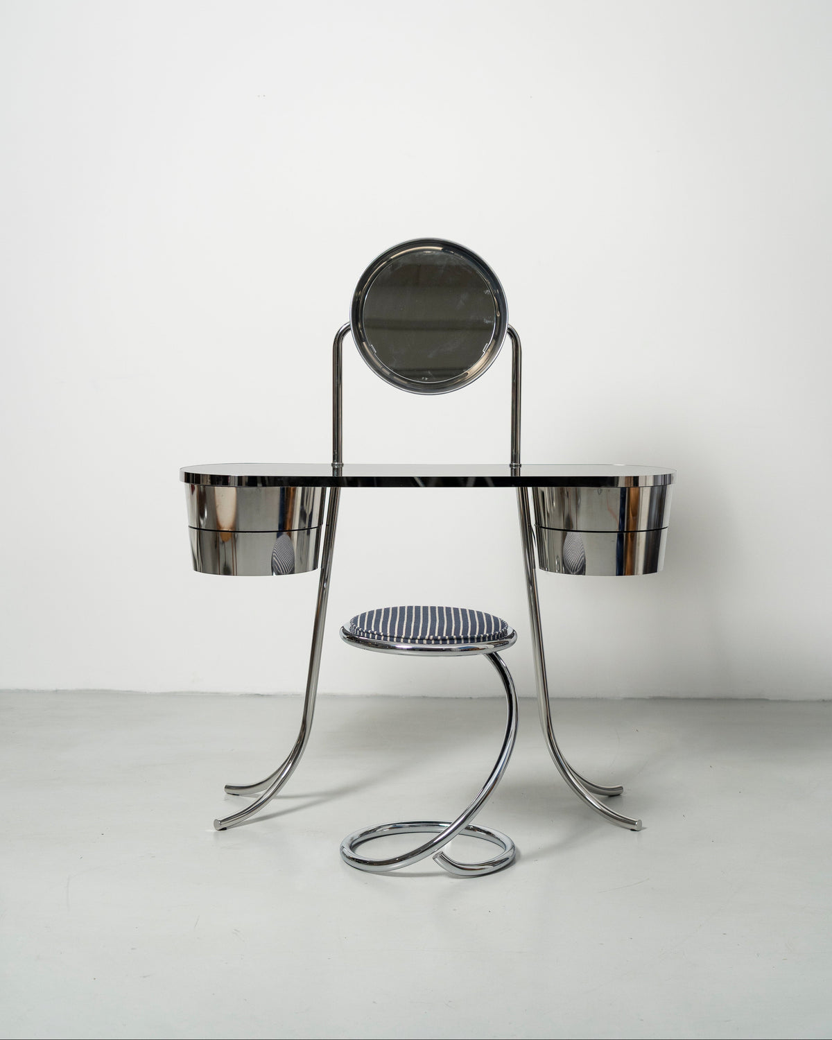 PH Dressing Table Steel by Poul Henningsen, Danish design classic (1919)
steel tube dressing table with two cylindrical containers with drawers and PH  Mirror lamp