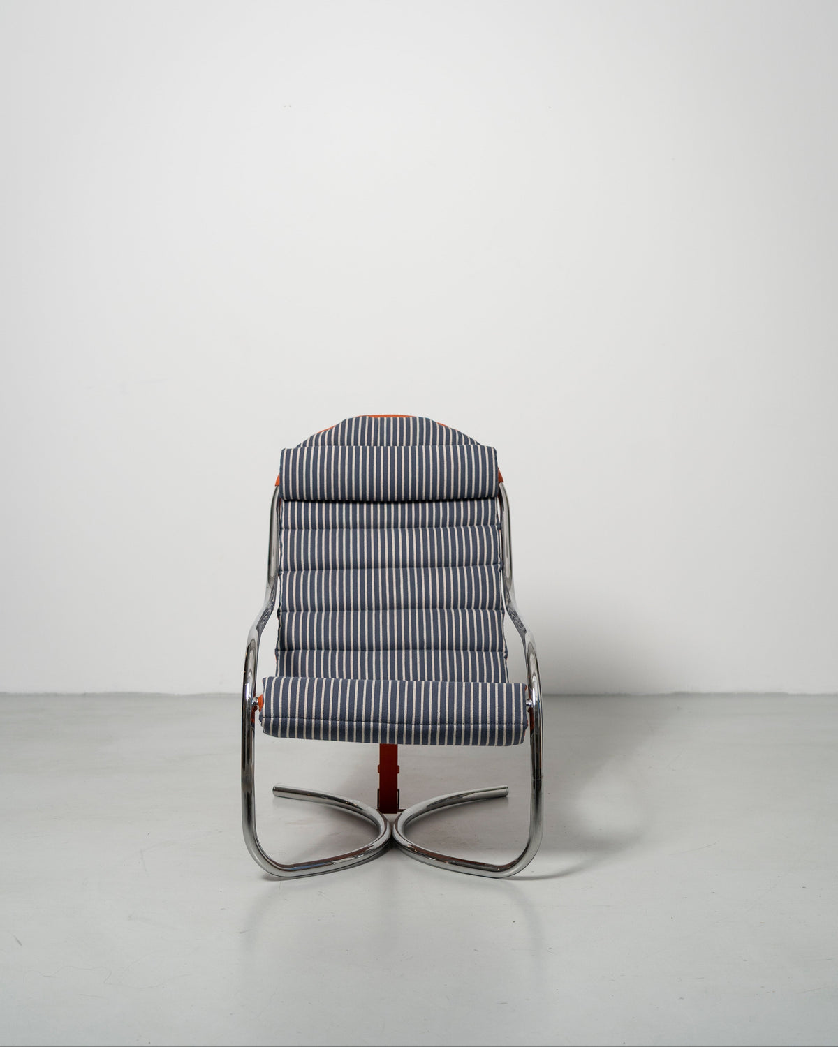 A wool fabric upholstered PH lounge chair with a chromed steel tube frame, designed by Poul Henningsen.