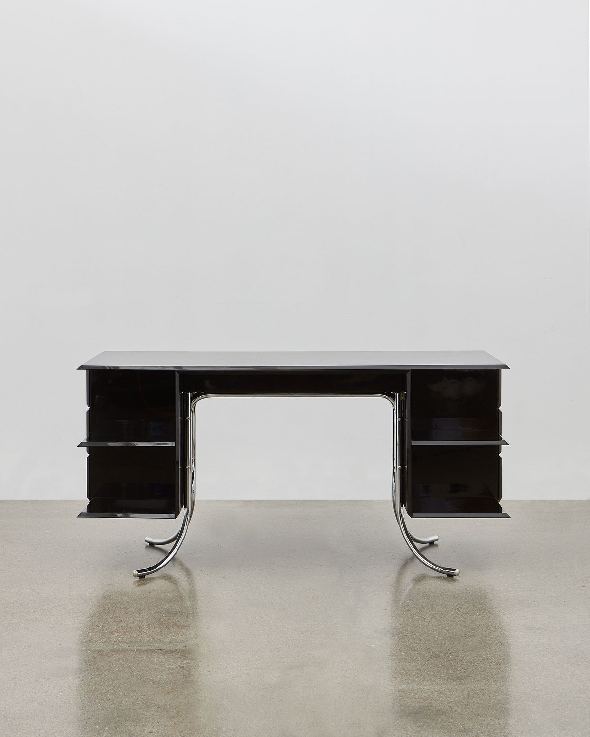 PH Office Desk by Poul Henningsen, Danish design classic (1930s)
A sleek black office desk with high gloss finish, six leather swing drawers, and chromed legs, designed by Poul Henningsen.