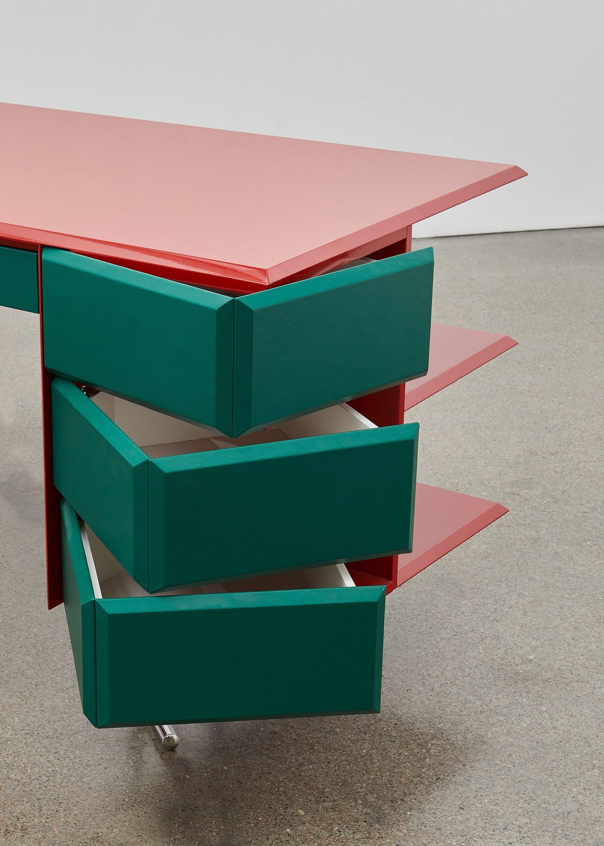 PH Office Desk by Poul Henningsen, Danish design classic (1930s)
A sleek red office desk with high gloss finish, six green leather swing drawers, and chromed legs, designed by Poul Henningsen.