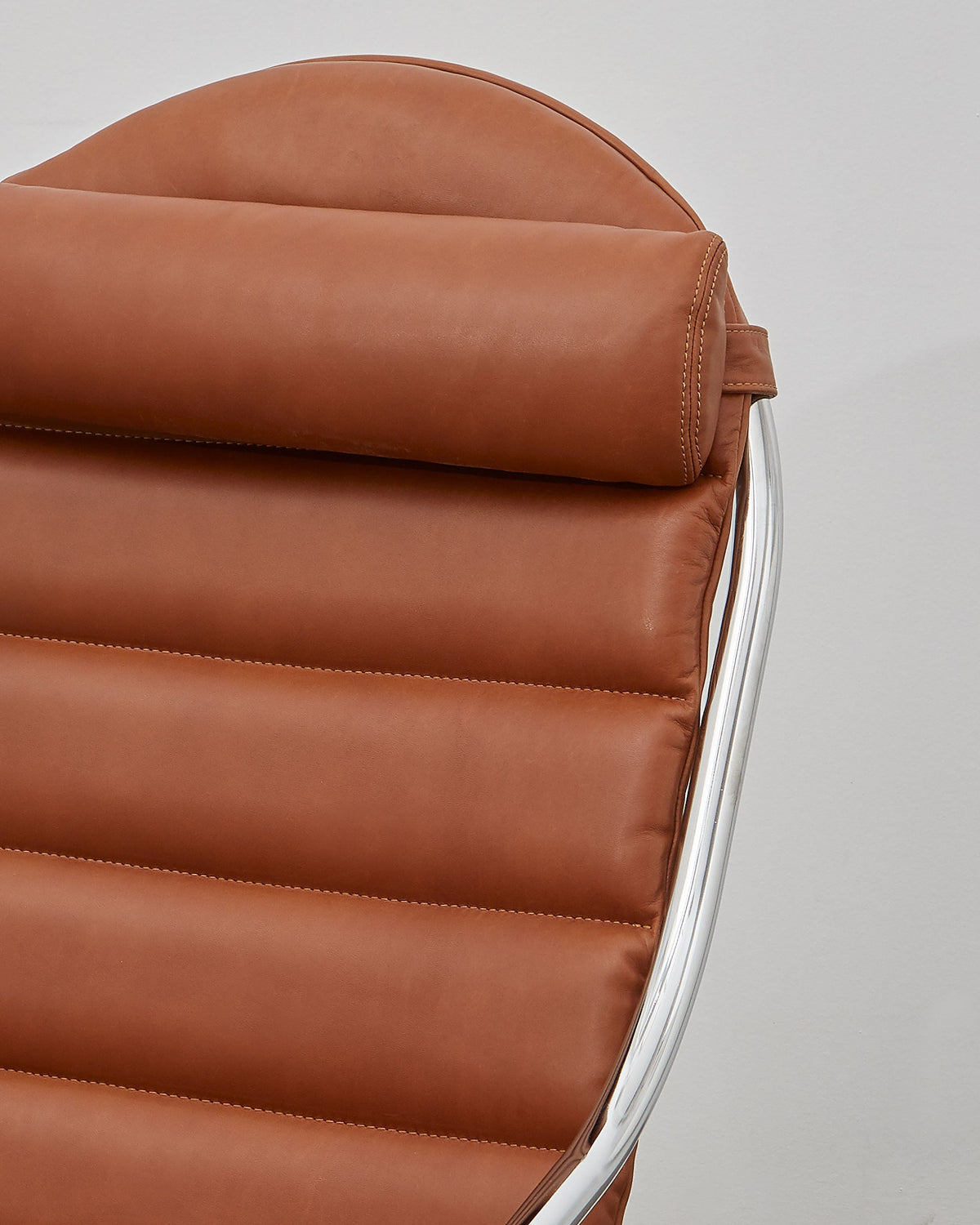 A walnut  leather upholstered PH lounge chair with a chromed steel tube frame, designed by Poul Henningsen.