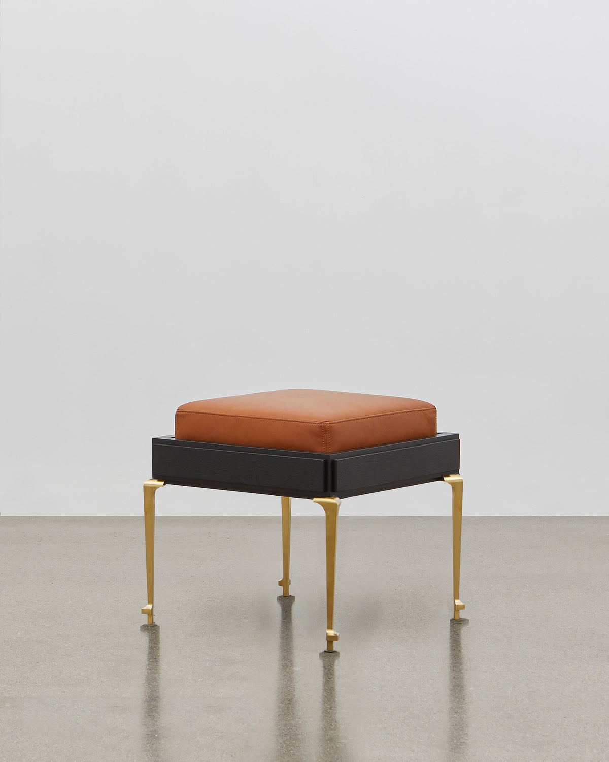 PH Stool by Poul Henningsen, Danish design classic (1920) A walnut upholstered stool standing on four brass legs